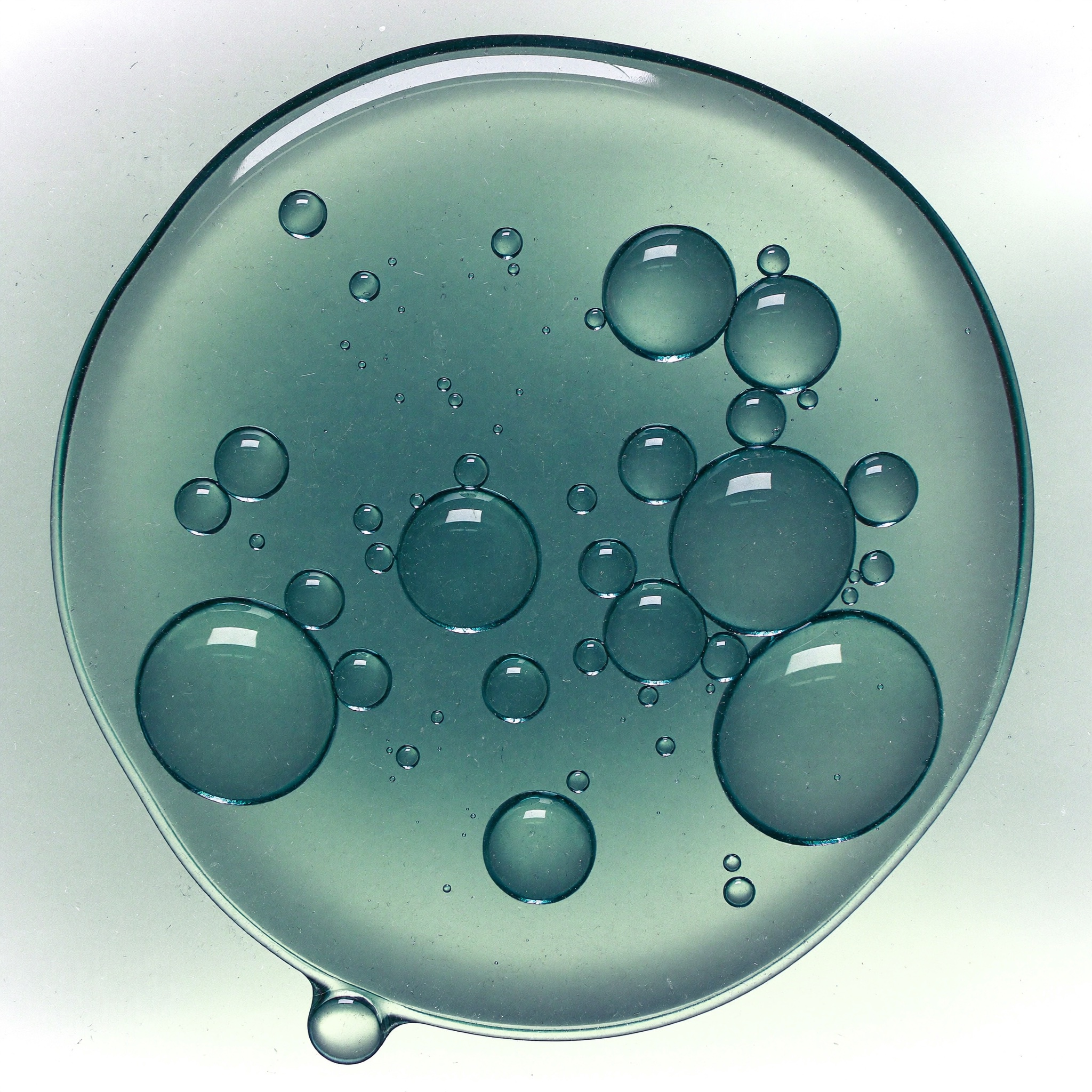 Macro photograph of translucent serum gel with suspended micro-bubbles